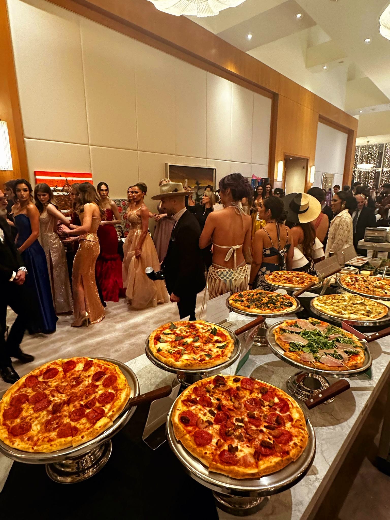 Eight fresh pizzas, black-tie crowd