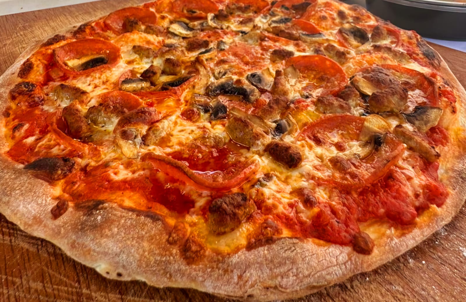 Meat Lovers — Mozzarella, pepperoni, sausage, bacon, grilled chicken