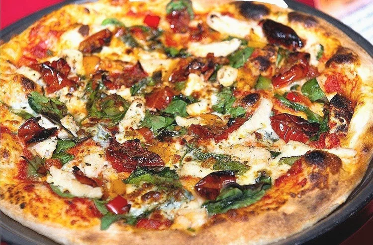 Chicken, spinach and sun-dried tomato signature pizza