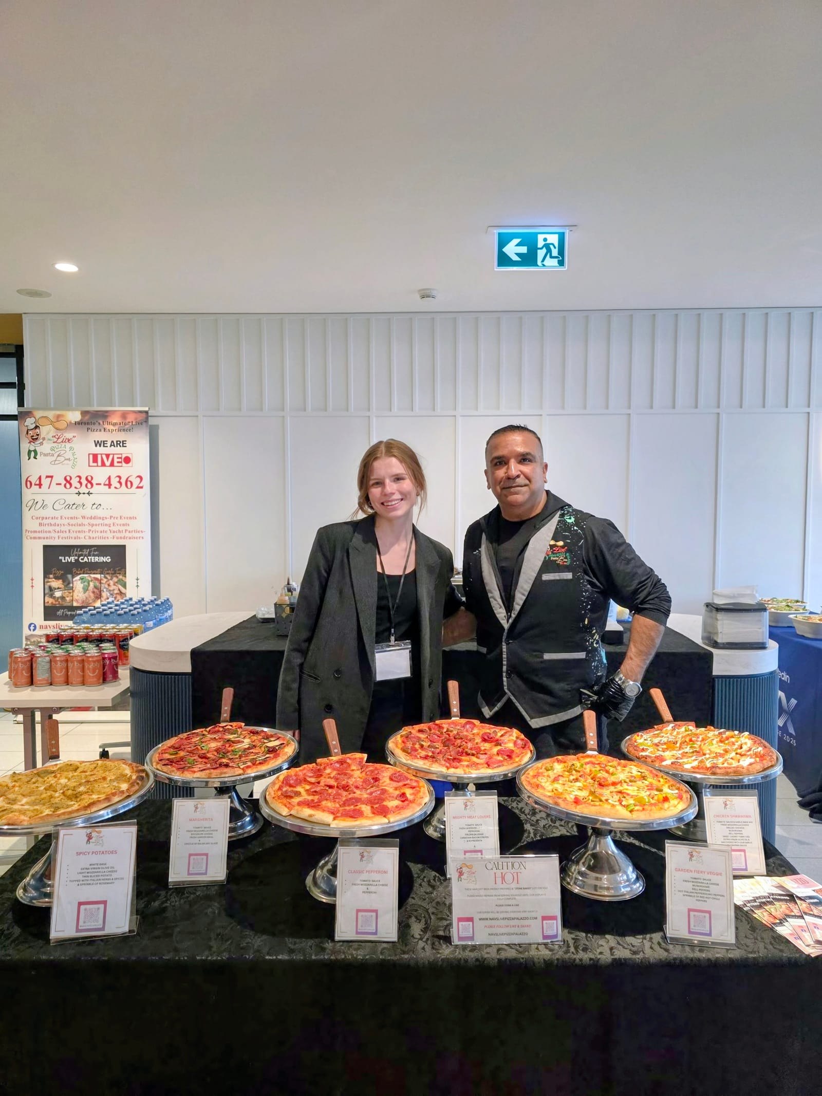 Chef and staff behind a full live pizza display at a corporate office event